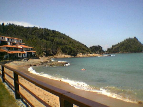 Casa frontal mar em condominio